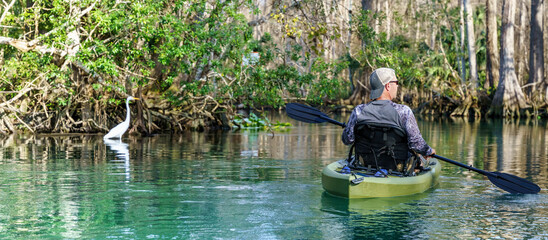 Man paddling in a Kayak in silver springs Florida