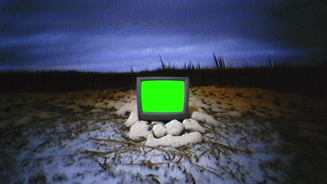 Classic television with a luminous green screen, barren landscape under a dramatic night sky.