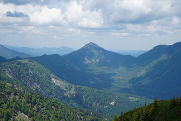 Small green hills and steep snowy mountains in Ötscherland, Lower Austria