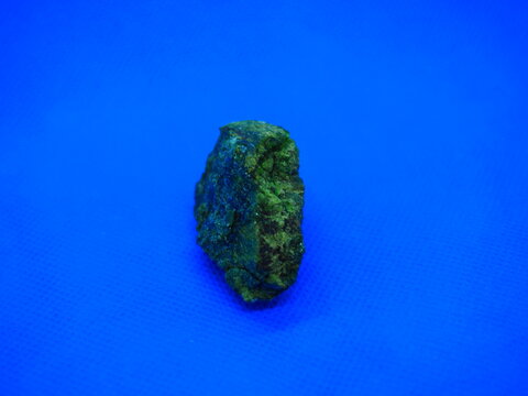 diopside, crystallized greenish stone.