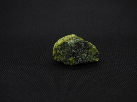 diopside, crystallized greenish stone.