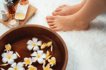 Couple indulges in blissful foot massage at luxurious spa salon for reflexology therapy in gentle...
