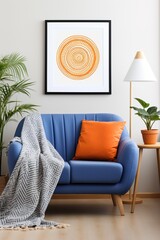 Blue couch with orange pillow and artwork of orange and white concentric circles