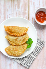 karepup and chili sauce on white background 