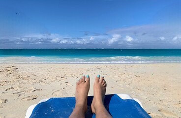 Having a wonderful vacation time at a beautiful beach with blue water and white soft wand.