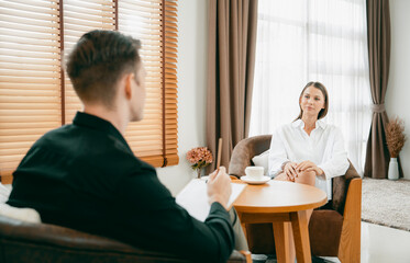 Psychological consultation gaining improvement on mental problem, happy young female patient doing therapy session while psychiatrist making diagnostic on mental illness. Unveiling