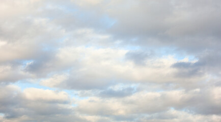 sky filled with fluffy clouds, symbolizing serenity and freedom