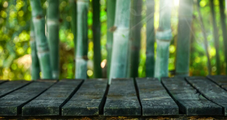 Empty old wood plank with bamboo forest background for product montage, natural wallpaper Horizontal.