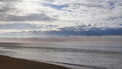 Fototapeta na wymiar clouds over the beach