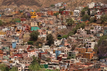 View onto a neighbourhood in Guanajuato with its colorful houses and an entrance to its famous tunnel system, Mexico