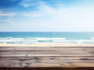 Fototapeta na wymiar Wooden table by the beach with blurred ocean and blue sky background