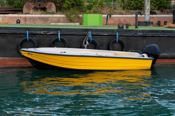 Yellow boat parked at the pier