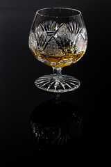 Luxury glass with rum on a black background