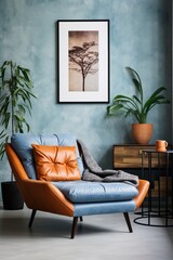 Blue and orange retro style room interior with single blue leather armchair and tree photo in black frame