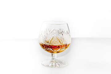 Luxury glass with rum on a white background