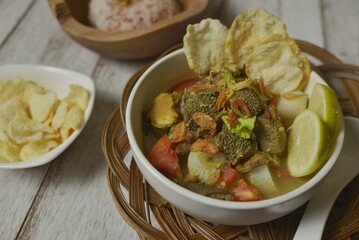 Soto Betawi, a hearty beef soup originated from Jakarta, among Betawi people. Made from beef meat, and beef offal or innards, white radish and coconut milk broth. 