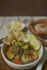 Soto Betawi, a hearty beef soup originated from Jakarta, among Betawi people. Made from beef meat, and beef offal or innards, white radish and coconut milk broth. 