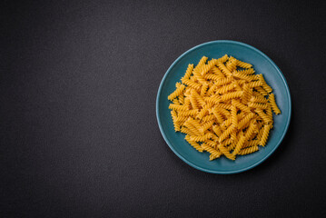 Raw fusilli pasta from whole grain wheat varieties