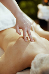 Obraz na płótnie Canvas Closeup on massage therapist in spa salon do therapeutic massage