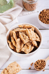 Alternative protein dry soy meat in a bowl on the table vertical view