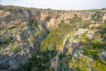 Cennet and Cehennem (English: heaven and hell) are the names of two large sinkholes in the Taurus Mountains, in Mersin Province, Turkey. The sinkholes are among the tourist attractions of the province