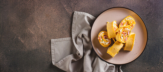 Tortilla rolls with salad of sausages, eggs, cheese and herbs on a plate top view web banner - obrazy, fototapety, plakaty