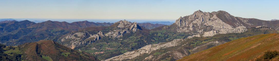 Fototapeta na wymiar Panoramic view of the town of Pelúgano and Peña mea peak, Aller, Asturias, Spain