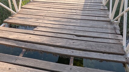 Old row of wooden steps across the river