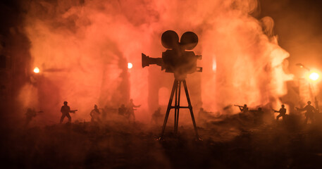 Action (War) movie concept. Military fighting silhouettes in destroyed city. Selective focus