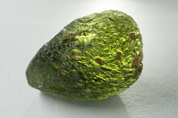 Vltava, or moldavite, is a precious stone, a natural green colored glass with a surface structure...