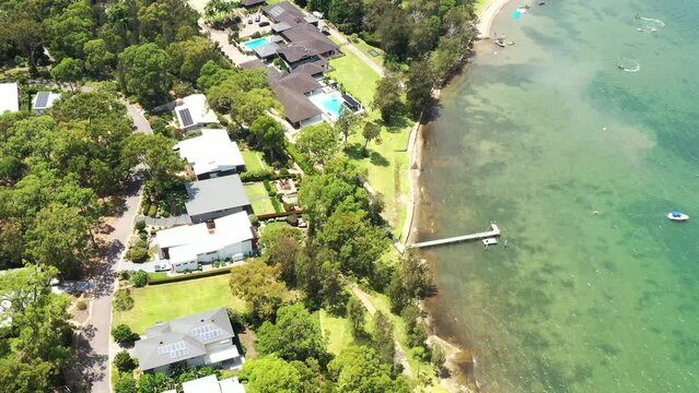 Lake Macquarie Murrays beach town waterfront in Australia – aerial 4k flying.
