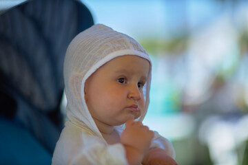 A baby is a happy baby in the first months of life, crawling around the house, smiling.