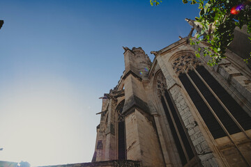 Fototapeta na wymiar Massive and tall Gothic building landmark Narbonne Cathedral in France
