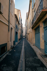 Narrow street on an old street in Narbonne, France
