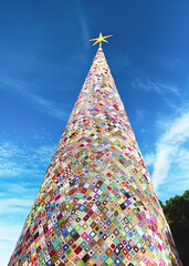 Amazing huge Christmas tree made from knitted crocheted granny squares. They crocheted with red,...