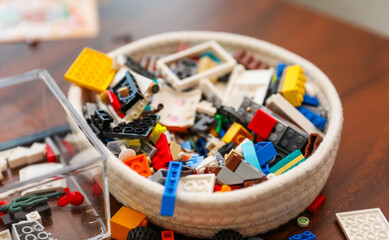 plastic bricks forming a colorful structure, plastic toys, symbolizing creativity and playful...