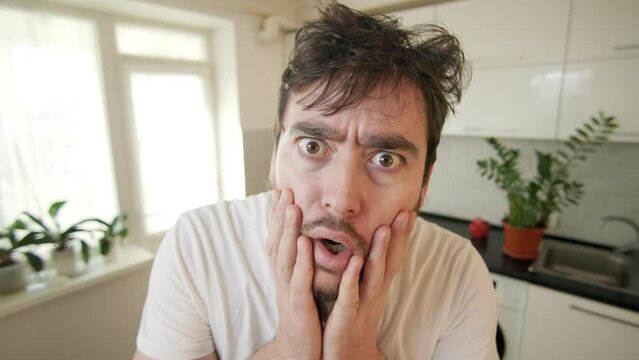 Captivating Gaze Close up, tousled haired individual expresses wide-eyed amazement in a compelling