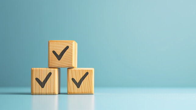 Checklist concept with copy space. Wood cubes with check marks on blue background.