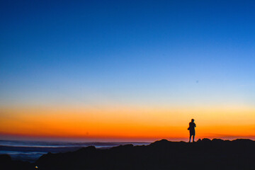 Embark on a journey of serenity with this captivating sunset photograph taken on a pristine Costa Rican beach. The awe-inspiring beauty of the sun setting over the horizon transforms the sky into a vi