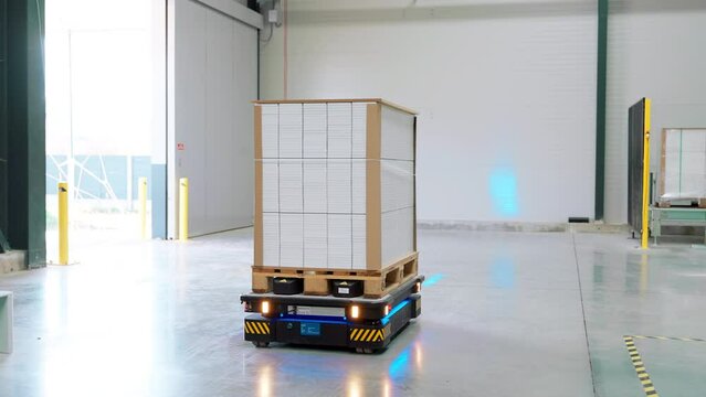 Industrial automation and robotics in modern industrial warehouse.