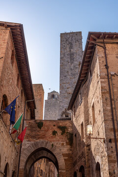 Fototapeta In the streets of San Gimignano, view on the towers Salvucci, Pettini and Chigi