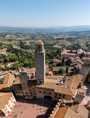 Fototapeta na wymiar Wide panoramic view over downtown San Gimignano, Torre Rognosa in the center, seen from Torre Grosso