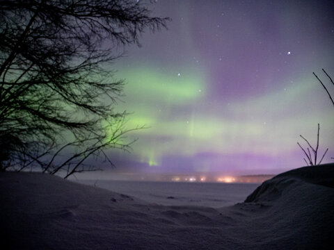 Spectacular northern lights on a lake in Lulea, Sweden