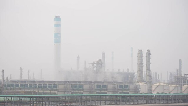 petrochemical plant in mist