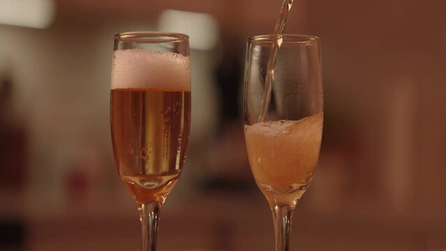 Champagne being poured into flutes for valentines day