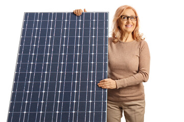 Causal mature woman behind a solar panel