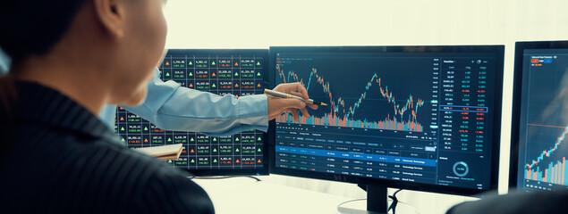 Expert successful businessman present stock market investment to smart beautiful investor during...