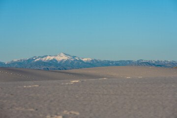 Snow Covered Mountains In The Distance From White Sands