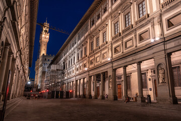 The famous Uffizi and the tower of the Palazzo Vecchio of Florence illuminated at night