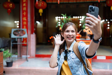 Young Asian woman backpack traveler using a mobile. Journey trip lifestyle. travel concept